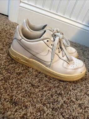 Nike Kids White Sneakers with Yellowed Sole. Fit me as a women’s 7.